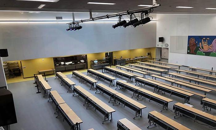 a lunchroom with the servery area and stage lighting